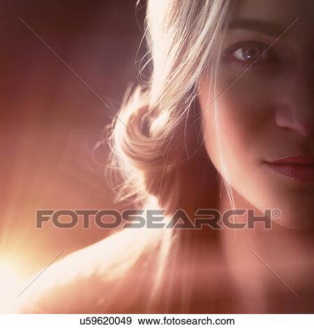 Stock Photo - Studio shot of beautiful blonde woman. Fotosearch