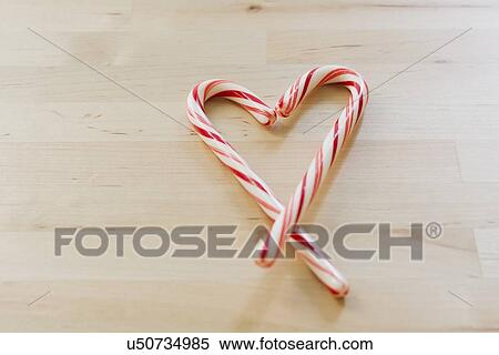Stock Photography - Studio shot of Christmas heart shaped candies. Fotosearch