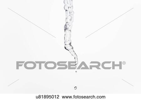 Stock Image - Studio shot of melting icicle. Fotosearch