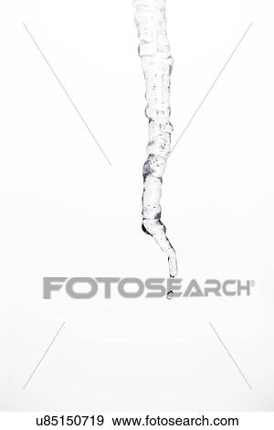 Stock Photo - Studio shot of melting icicle. Fotosearch