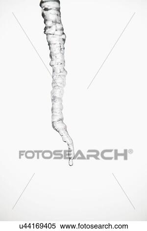 Stock Photography - Studio shot of melting icicle. Fotosearch