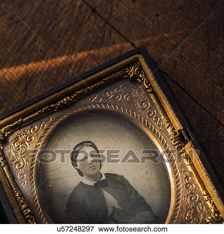 Stock Photo - Studio shot of old fashioned photograph in picture frame. Fotosearch