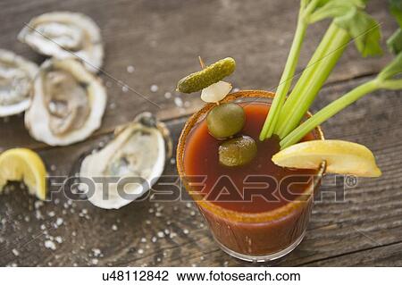 Studio shot of oysters and bloody mary View Large Photo Image Stock Image - Studio shot of oysters and bloody mary. Fotosearch