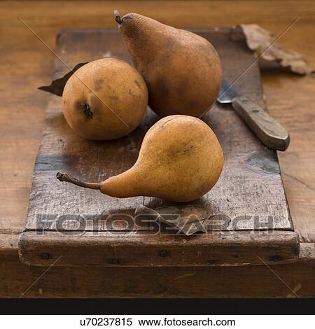 Studio shot of pears on cutting board View Large Photo Image Stock Photography - Studio shot of pears on cutting board. Fotosearch