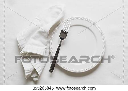 Stock Photography - Studio shot of plate and fork. Fotosearch