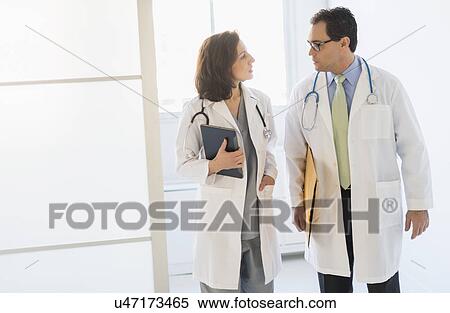 Stock Photography - Two doctors talking in hospital. Fotosearch
