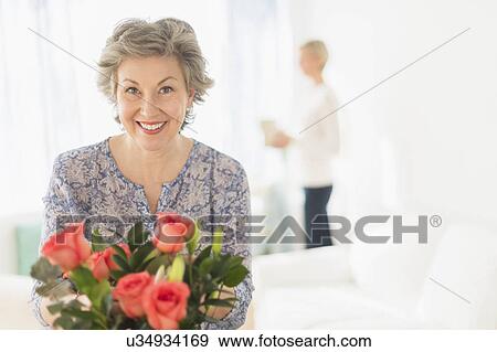 Woman arranging bouquet View Large Photo Image Stock Photo - Woman arranging bouquet. Fotosearch