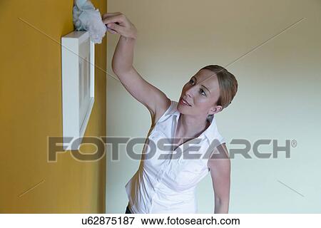 Woman cleaning house View Large Photo Image Stock Photo - Woman cleaning house. Fotosearch