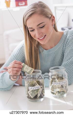 Woman collecting savings View Large Photo Image Stock Image - Woman collecting savings. Fotosearch