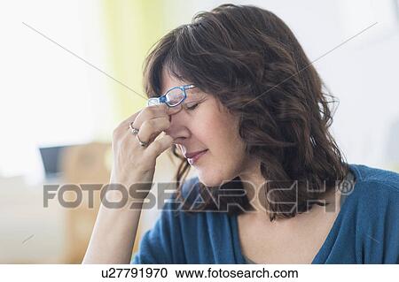 Woman having headache View Large Photo Image Stock Image - Woman having headache. Fotosearch