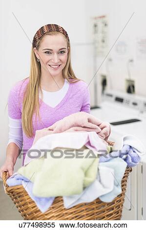 Woman in laundry room View Large Photo Image Stock Photography - Woman in laundry room. Fotosearch