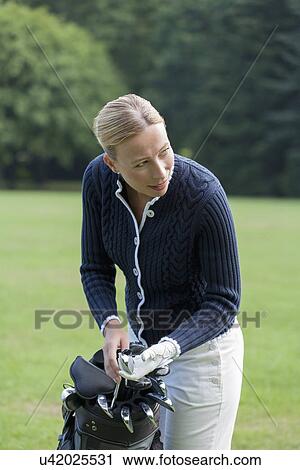 Woman on golf course View Large Photo Image Stock Image - Woman on golf course. Fotosearch