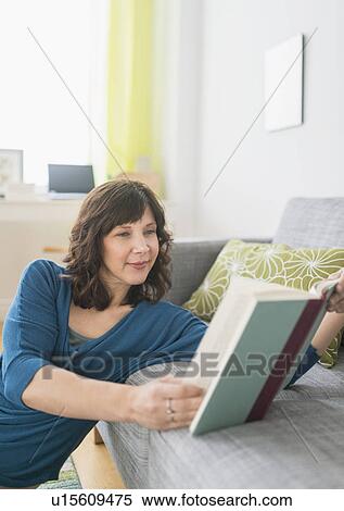 Woman reading book at home View Large Photo Image Stock Photography - Woman reading book at home. Fotosearch