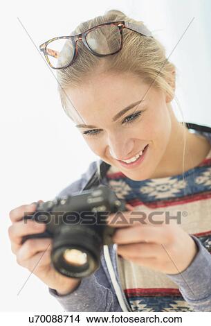 Woman taking picture with vintage camera View Large Photo Image Picture - Woman taking picture with vintage camera. Fotosearch