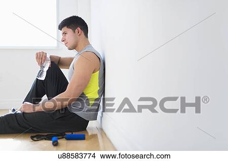 Picture - Young man at gym. Fotosearch
