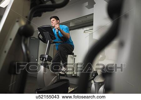 Young man at gym View Large Photo Image Stock Image - Young man at gym. Fotosearch
