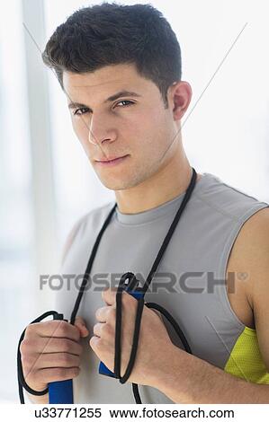 Young man at gym View Large Photo Image Stock Photography - Young man at gym. Fotosearch