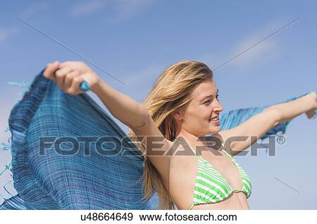 Young woman on beach View Large Photo Image Stock Photo - Young woman on beach. Fotosearch