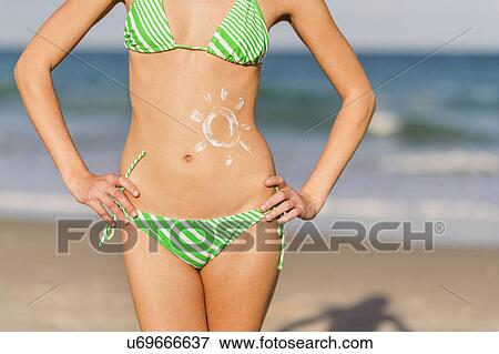 Young woman on beach View Large Photo Image Stock Photo - Young woman on beach. Fotosearch
