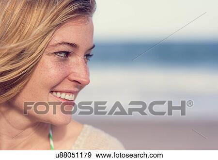 Young woman on beach View Large Photo Image Stock Photo - Young woman on beach. Fotosearch