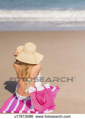 Young woman on beach View Large Photo Image Stock Photograph - Young woman on beach. Fotosearch