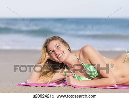 Stock Photography - Young woman on beach. Fotosearch