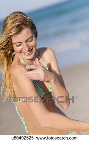 Young woman on beach View Large Photo Image Stock Photography - Young woman on beach. Fotosearch