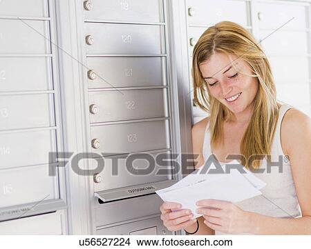 Young woman reading letters View Large Photo Image Picture - Young woman reading letters. Fotosearch