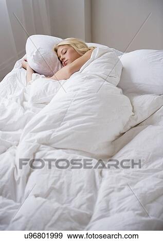 Stock Photo - Young woman sleeping. Fotosearch