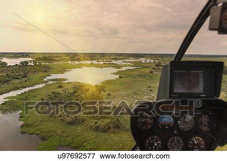 Aerial view from helicopter, Okavango Delta, Chobe National Park, Botswana, Africa View Large Photo Image Stock Photo - Aerial view from helicopter, Okavango Delta, Chobe National Park, Botswana, Africa. Fotosearch