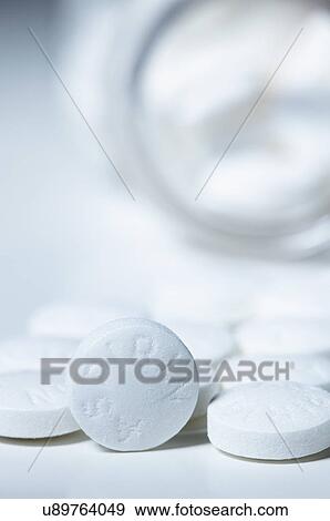 Stock Photo - Aspirin pills. Generic 325mg aspirin pills. Fotosearch