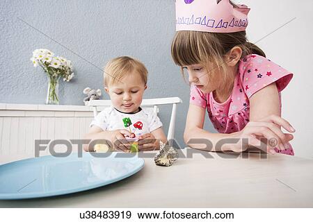 Baby boy playing with cupcake View Large Photo Image Stock Photo - Baby boy playing with cupcake. Fotosearch