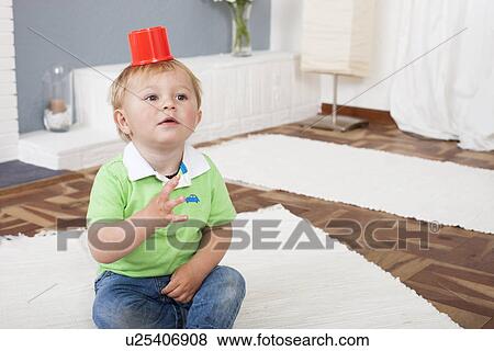 Baby boy playing with plastic toys View Large Photo Image Stock Photo - Baby boy playing with plastic toys. Fotosearch