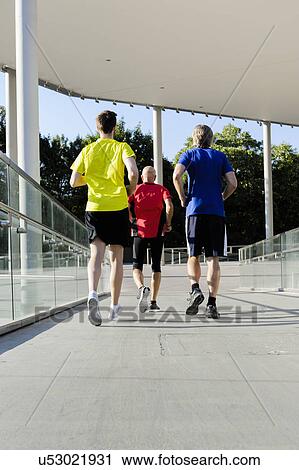 Stock Image - Backview of runners. Fotosearch