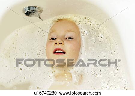 Boy playing in bath View Large Photo Image Stock Image - Boy playing in bath. Fotosearch