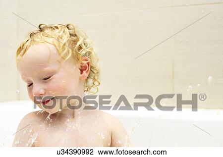 Boy playing in bath View Large Photo Image Stock Image - Boy playing in bath. Fotosearch