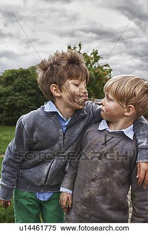 Brothers with muddy faces, arm around View Large Photo Image Stock Photography - Brothers with muddy faces, arm around. Fotosearch