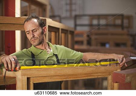 Carpenter measuring frame View Large Photo Image Stock Photography - Carpenter measuring frame. Fotosearch