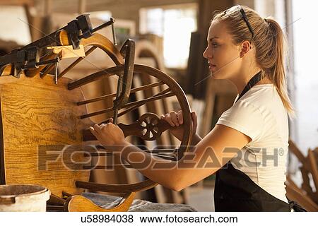 Carpenter measuring wooden chair View Large Photo Image Stock Photo - Carpenter measuring wooden chair. Fotosearch