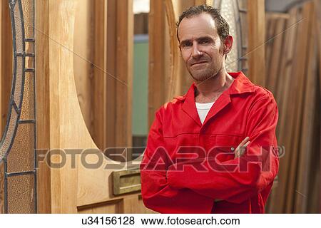 Carpenter with arms folded, portrait View Large Photo Image Stock Photo - Carpenter with arms folded, portrait. Fotosearch