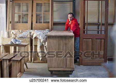 Carpenter working in workshop View Large Photo Image Stock Image - Carpenter working in workshop. Fotosearch