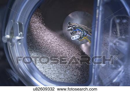 Close up of spray coating tablets in pharmaceutical factory View Large Photo Image Stock Image - Close up of spray coating tablets in pharmaceutical factory. Fotosearch
