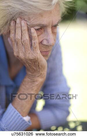 Stock Photograph - Close up of unhappy senior woman. Fotosearch