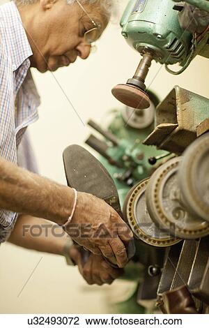 Cobbler polishing shoe View Large Photo Image Stock Image - Cobbler polishing shoe. Fotosearch