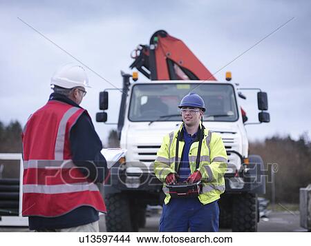 Emergency Response Team workers training with truck crane View Large Photo Image Picture - Emergency Response Team workers training with truck crane. Fotosearch