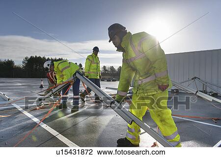 Emergency Response Team workers erecting tent control centre View Large Photo Image Stock Image - Emergency Response Team workers erecting tent control centre. Fotosearch