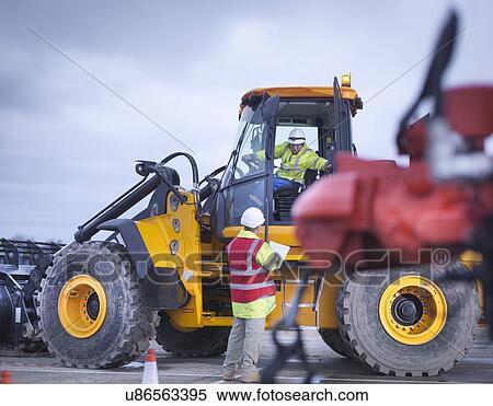 Emergency Response Team workers training with digger View Large Photo Image Stock Photography - Emergency Response Team workers training with digger. Fotosearch