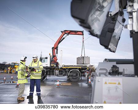 Emergency Response workers training with truck crane View Large Photo Image Stock Image - Emergency Response workers training with truck crane. Fotosearch