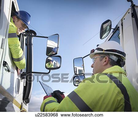 Emergency Response workers with specialist equipment and rescue trucks View Large Photo Image Stock Photo - Emergency Response workers with specialist equipment and rescue trucks. Fotosearch
