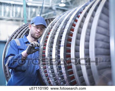 Engineer measuring high pressure steam turbine blade in workshop View Large Photo Image Stock Image - Engineer measuring high pressure steam turbine blade in workshop. Fotosearch